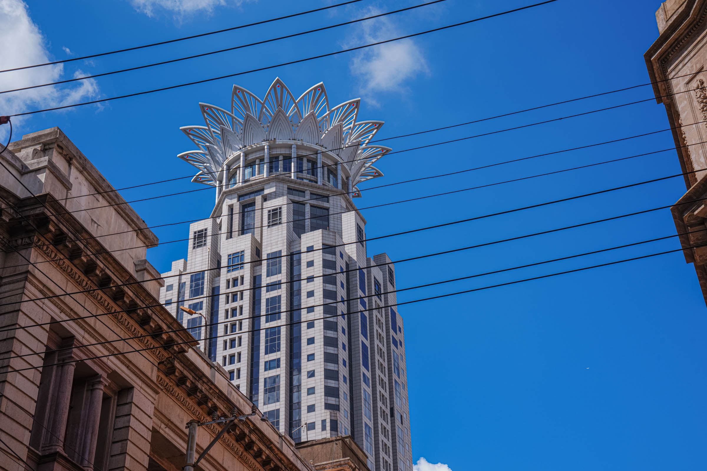 Shanghai’s iconic Oriental Pearl TV Tower with its distinctive pink spheres and spire rises 468 meters into the sky, a futuristic landmark on the skyline that symbolizes the city’s rapid modernization and unique architectural style.