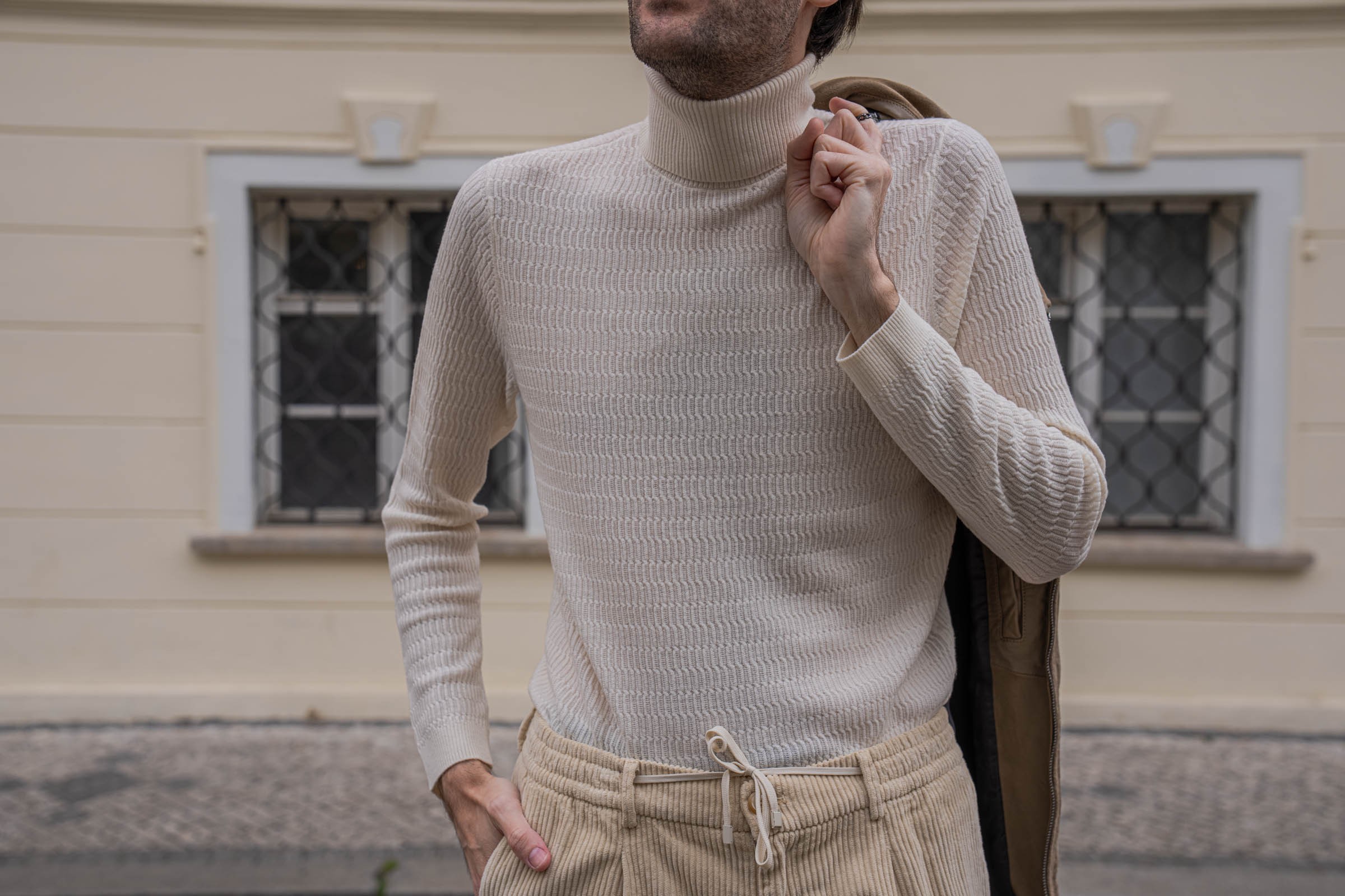 Marko Tadić, founder of Mr.M by Marko Tadić blog, close-up of the Belstaff phoenix logo patch and chest zip pocket on a sand suede aviator jacket.