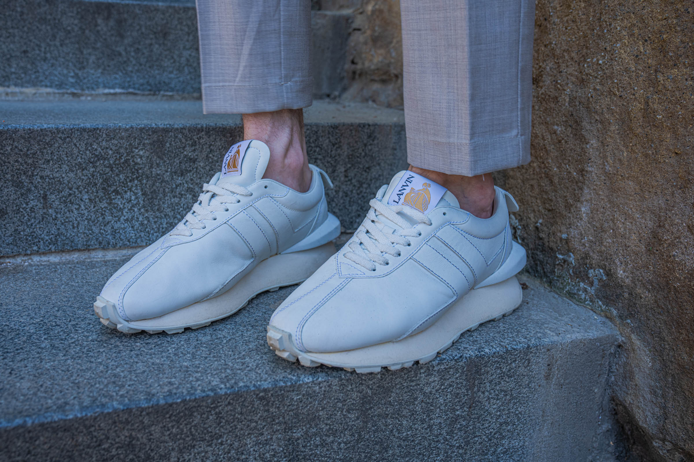 Side view of white Lanvin Bumpr leather sneakers with the signature heel bump, worn by Marko Tadić, founder of the Mr.M blog