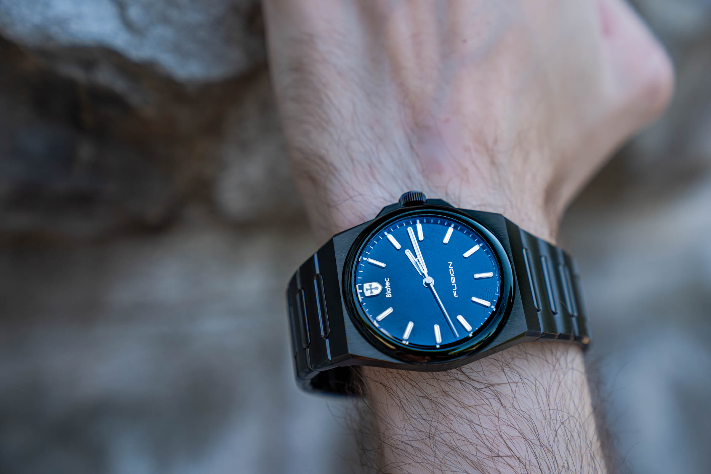 Macro shot of the Biatec Fusion 03 watch with black lacquered dial, blue anti-reflective sheen and Made in Slovakia inscription, worn by Marko Tadić, founder of the Mr.M blog