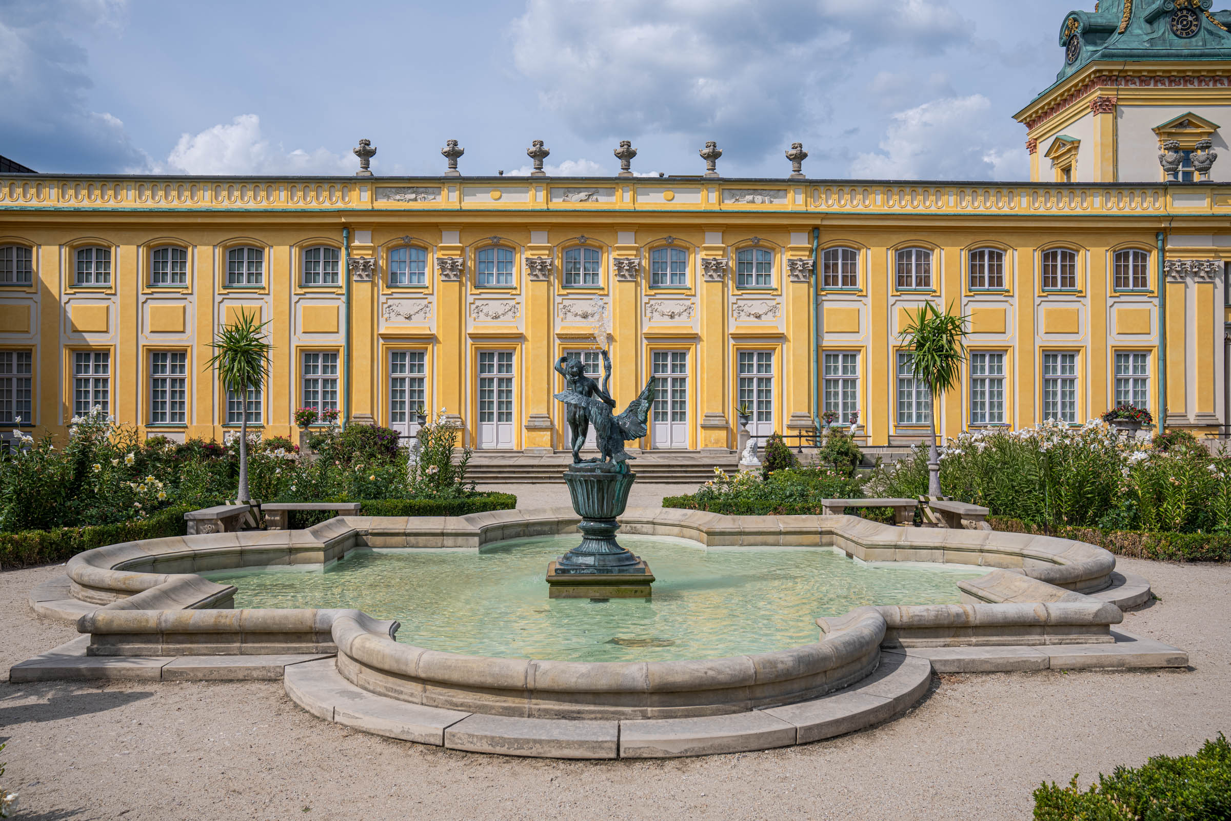 Garden facade of Wilanów Palace in Warsaw with yellow walls and Baroque fountain, Mr.M by Marko Tadić