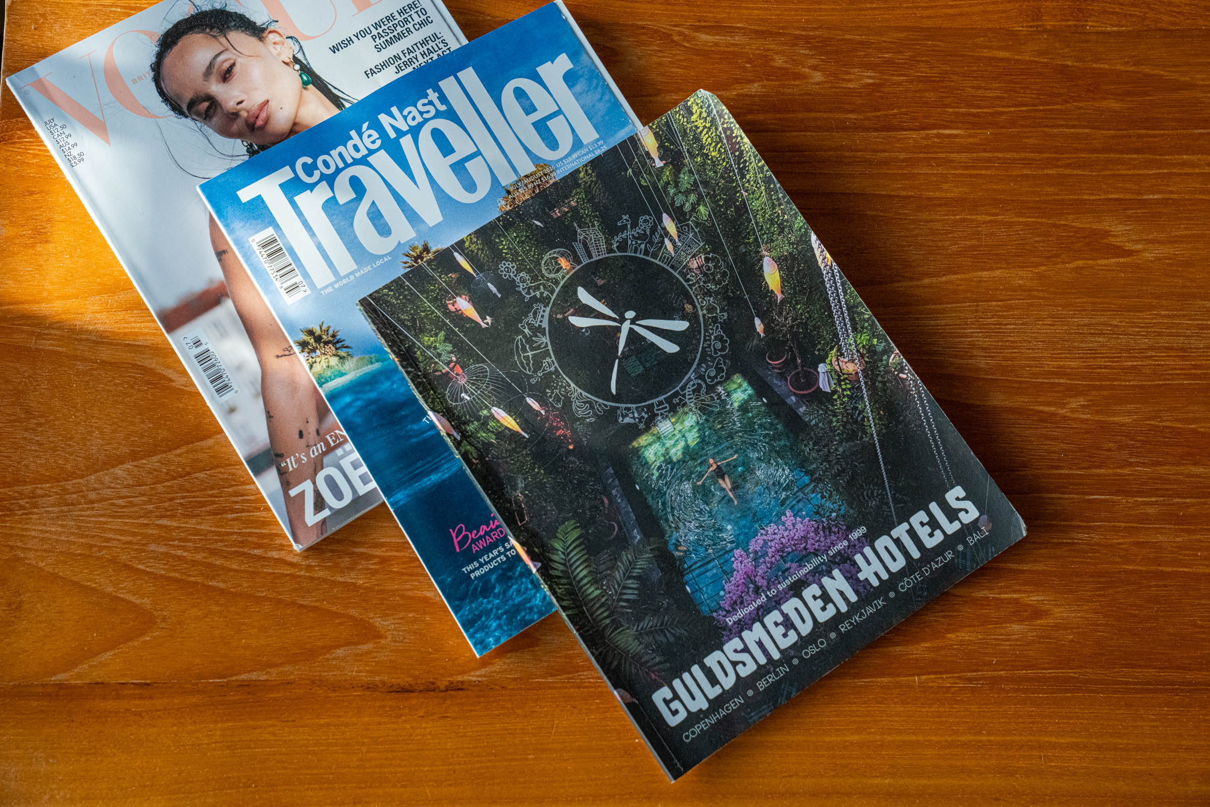 Vogue, Condé Nast Traveller and the Guldsmeden Hotels magazine on a live-edge wooden table, photo by Marko Tadić, founder of Mr.M blog