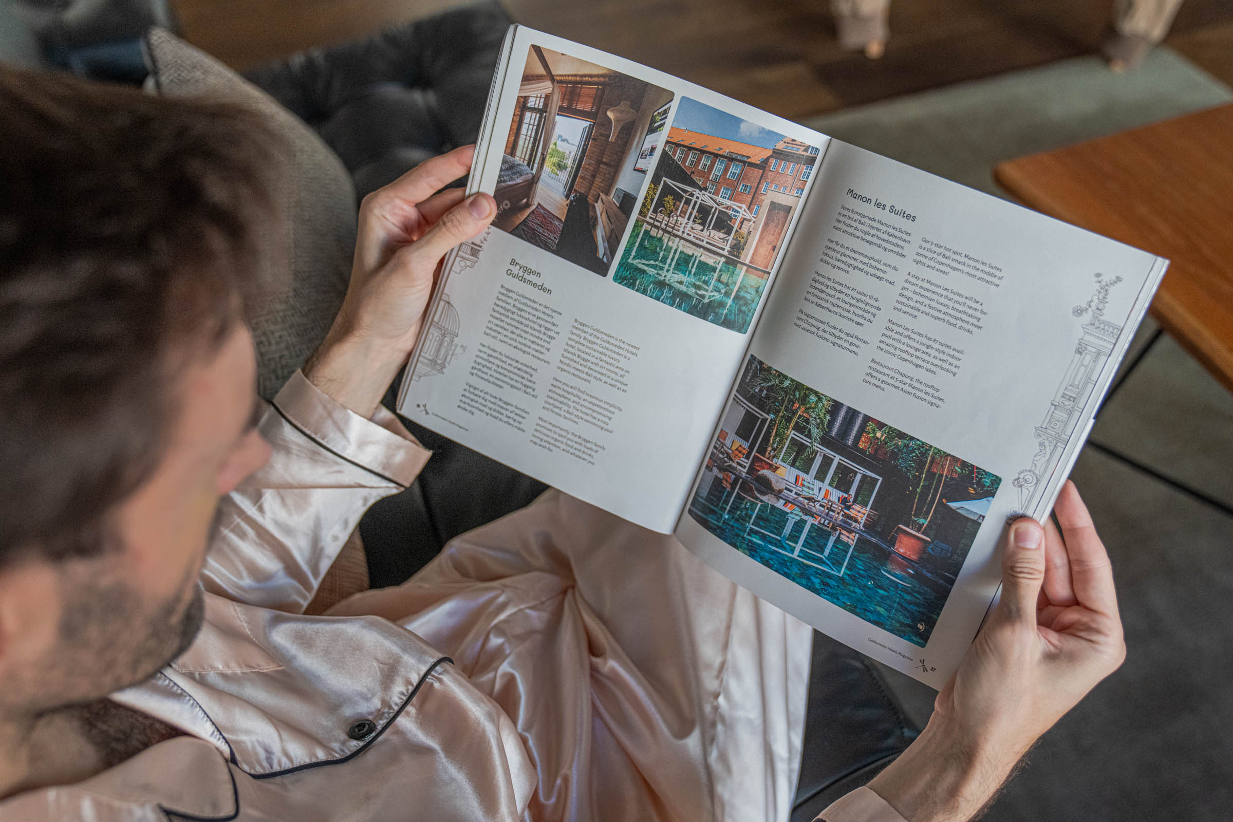 Marko Tadić turning to the Manon Les Suites feature inside the Guldsmeden Hotels magazine during his Copenhagen stay