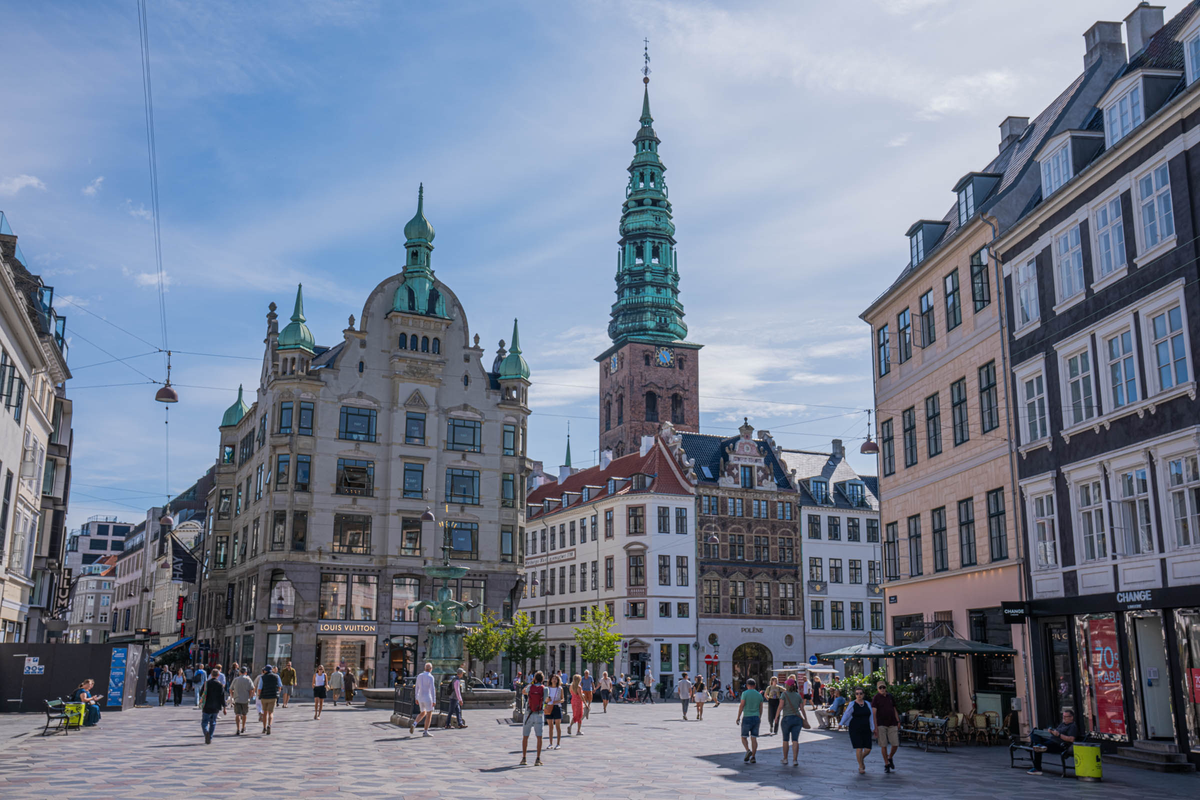 Amagertorv square in Copenhagen with the bronze Stork Fountain and the green spire of Nikolaj church, photo by Marko Tadić, founder of Mr.M blog