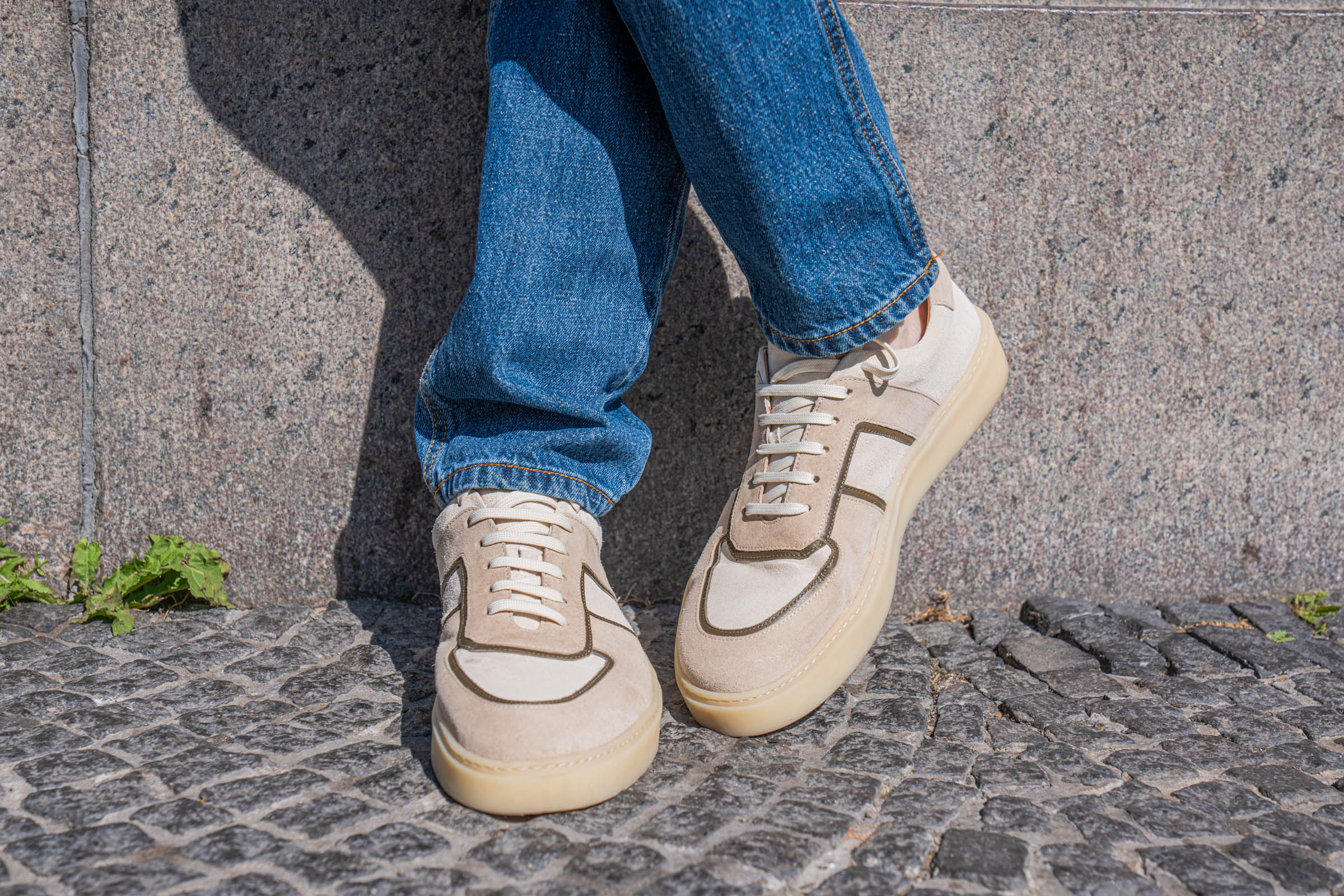 Carlos Santos Lonnie 1987 STB suede sneakers in cream and sand with olive trim and gum sole, photographed on Copenhagen cobblestones