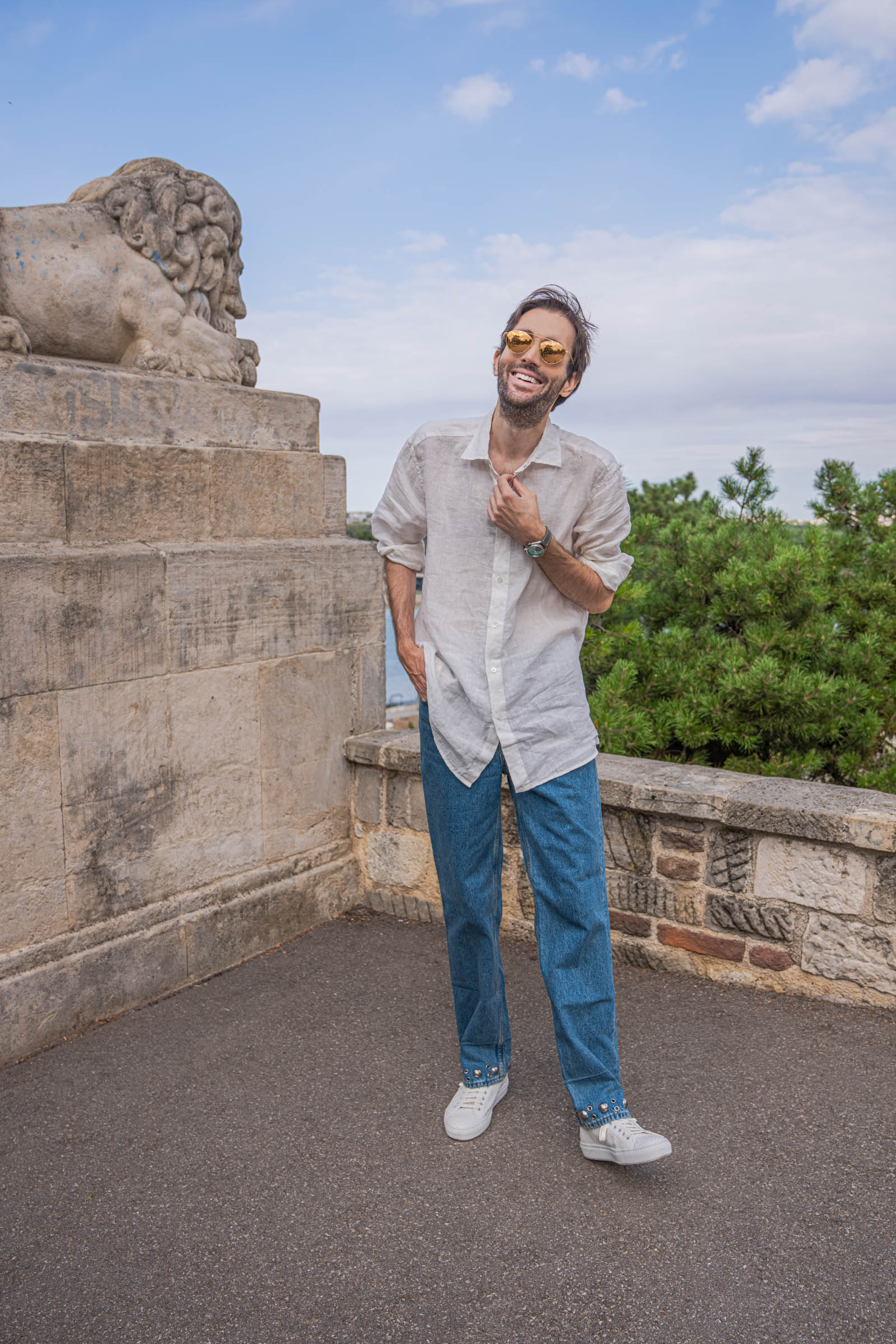 Full-length Valentino look on Marko Tadić: linen shirt, straight denim and white sneakers