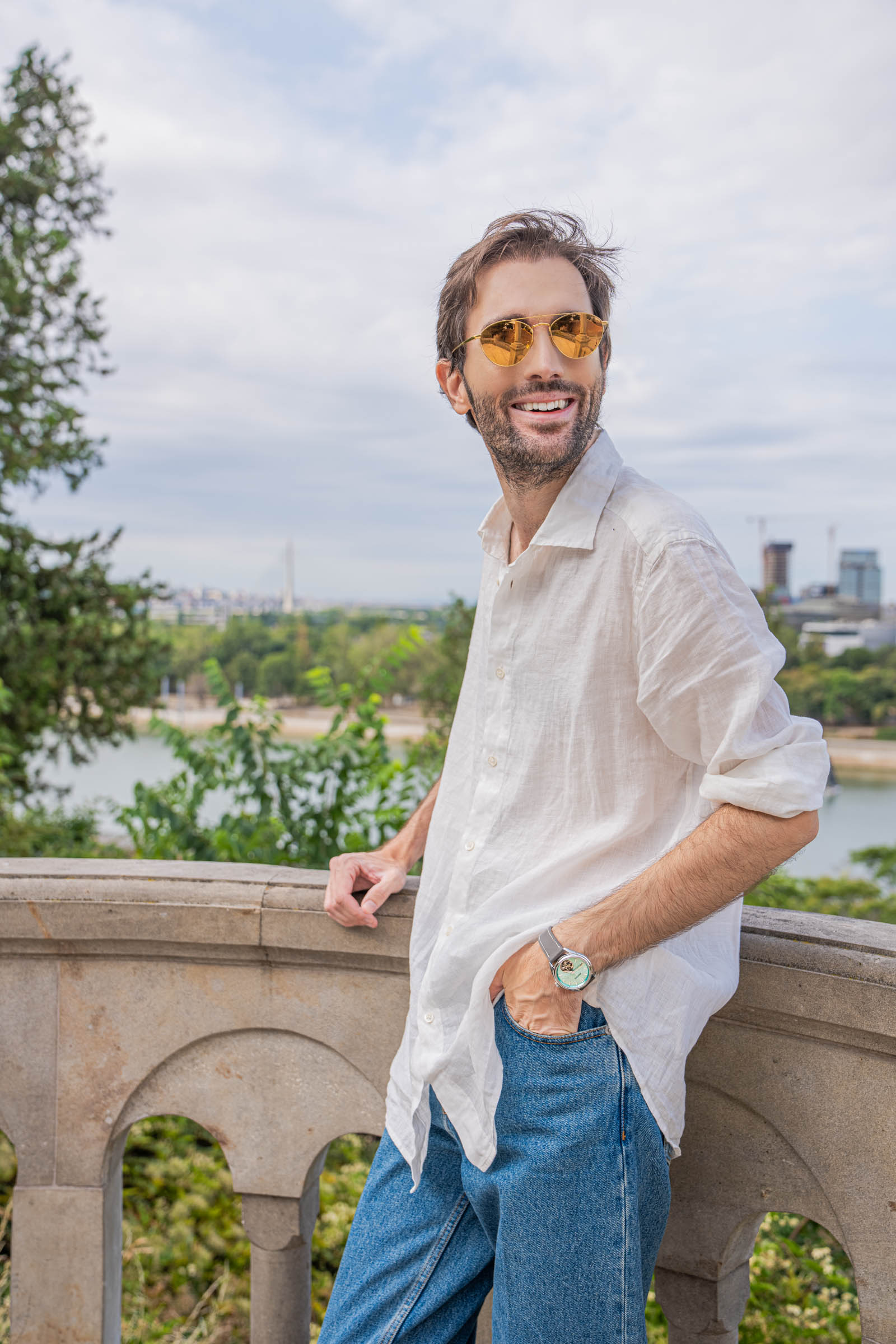 Marko Tadić in gold mirrored Linda Farrow aviators and a Valentino white linen shirt