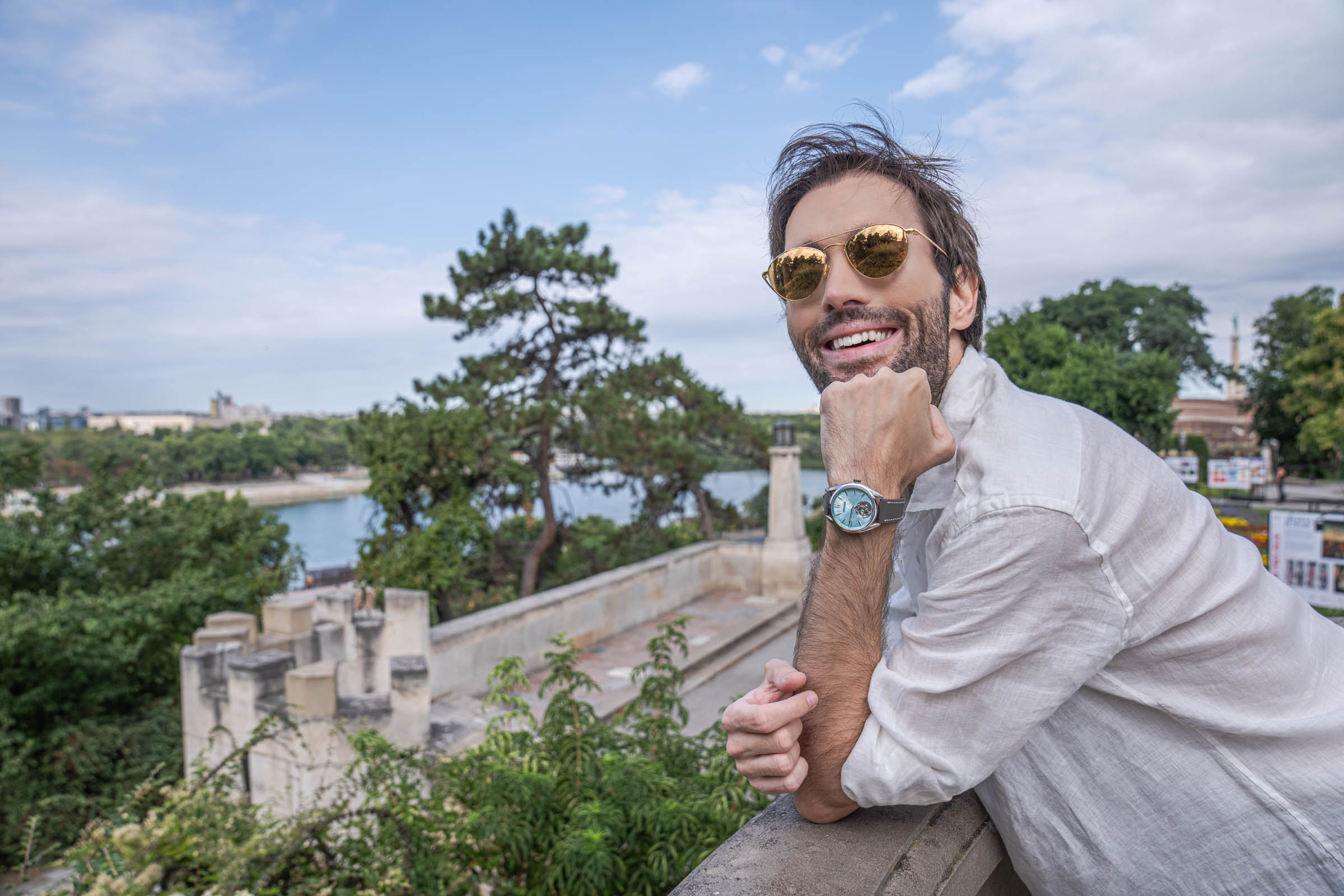 Portrait of Marko Tadić in Linda Farrow gold aviators, Valentino linen and a Peacock tourbillon