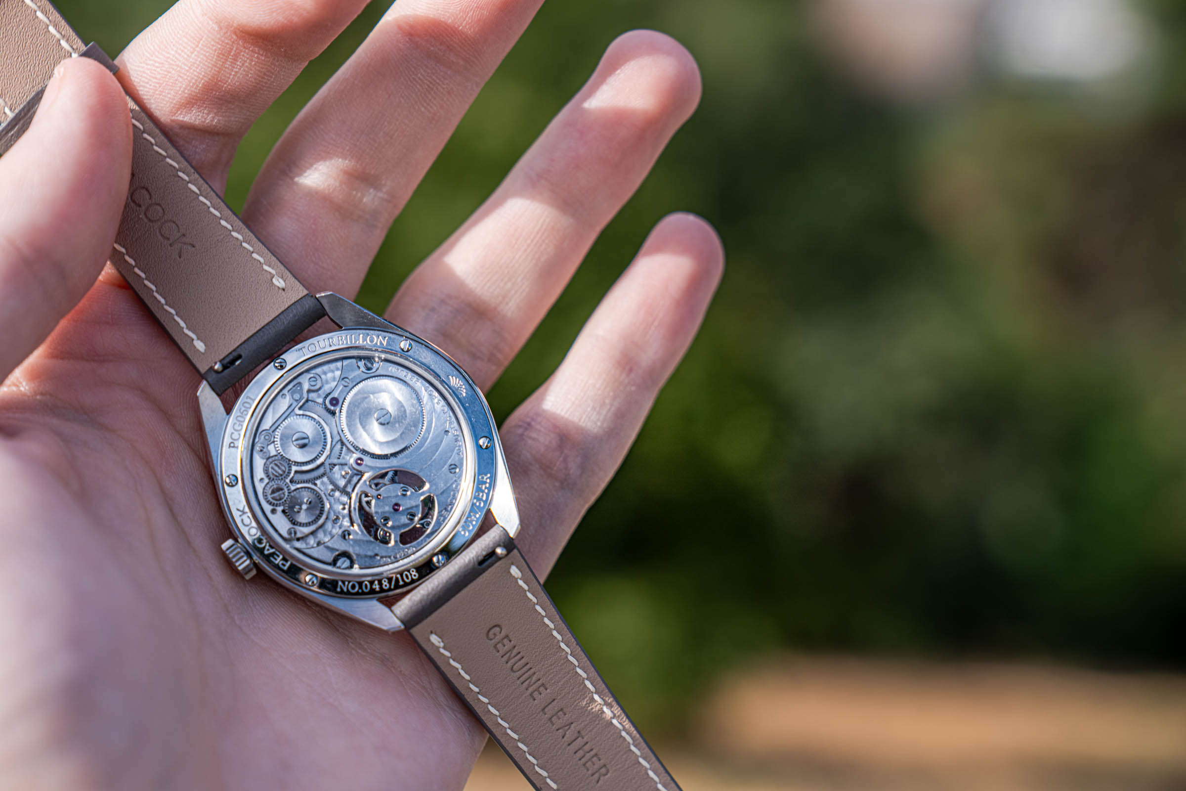 Caseback of the Peacock Divine Craft Tourbillon showing PCG0601 and number 048/108