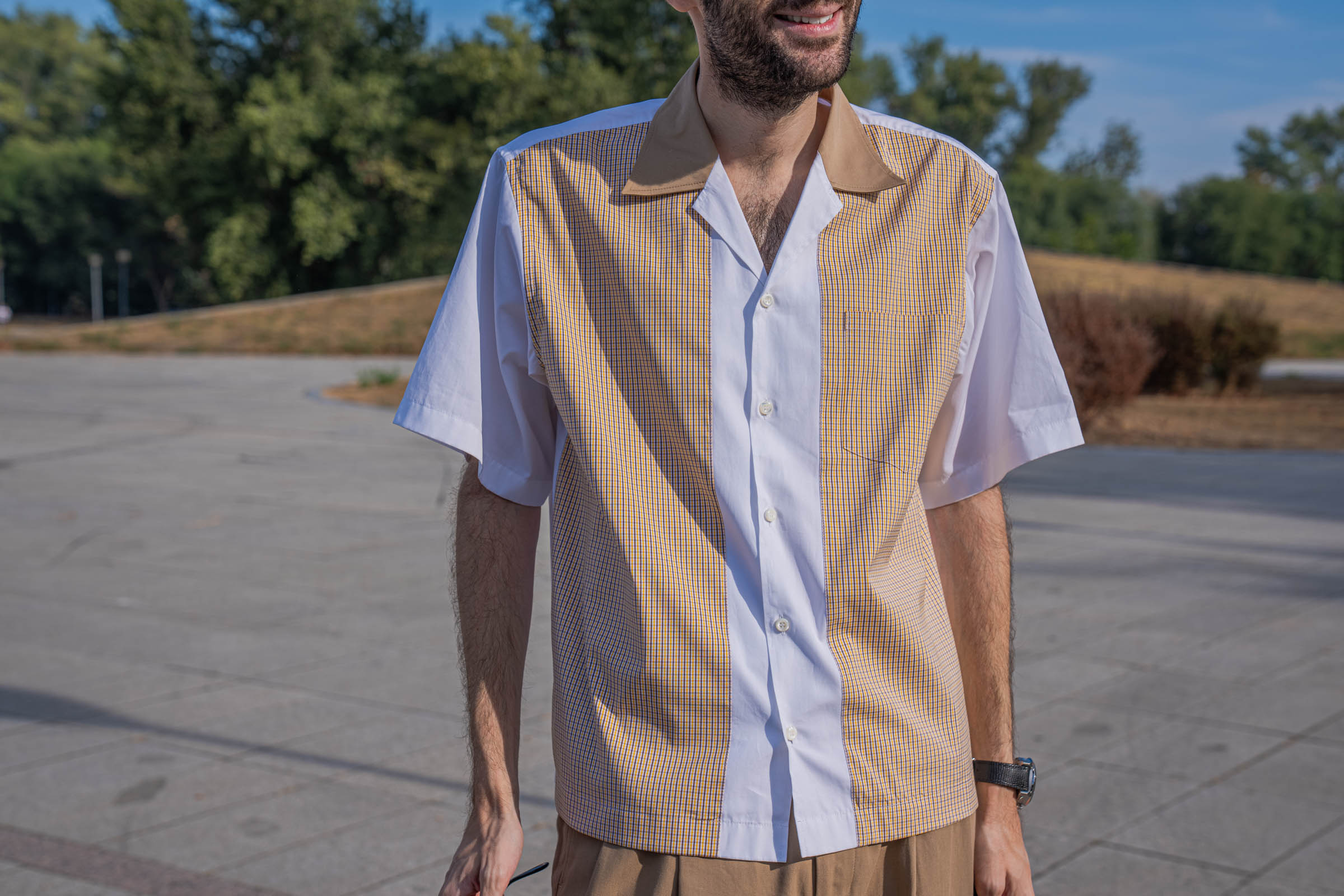 Front view of the Dsquared2 short-sleeve poplin shirt worn by Marko Tadić, with white placket, mustard check panels, camel spread collar and patch pocket