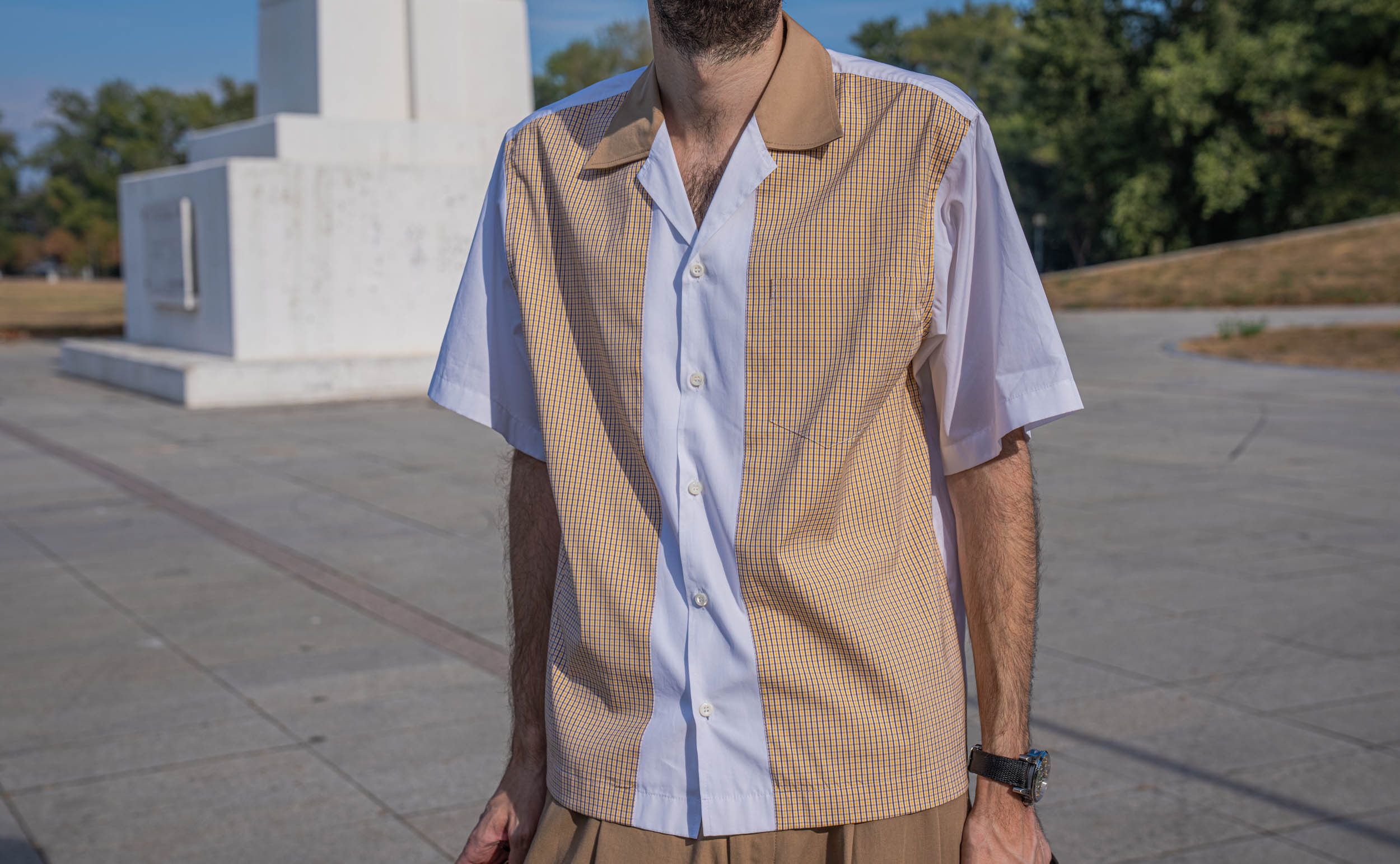 Marko Tadić of the Mr.M blog shows the vertical panels of the shirt in his Dsquared2 outfit, worn untucked over pleated trousers with the Bard's Whisper watch on his wrist