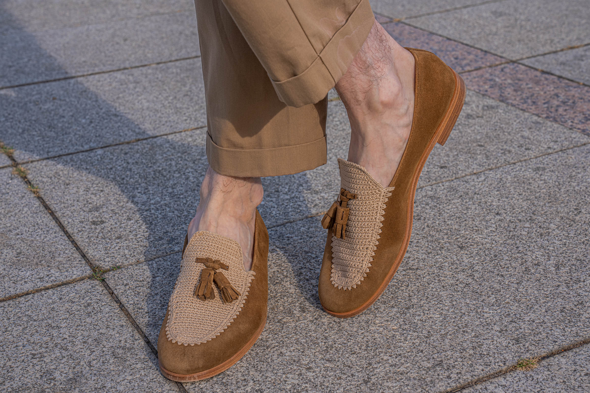 Fratelli Rossetti crochet tassel loafers with natural leather soles in mid-step, worn sockless by Mr.M founder Marko Tadić under turned-up tan trousers