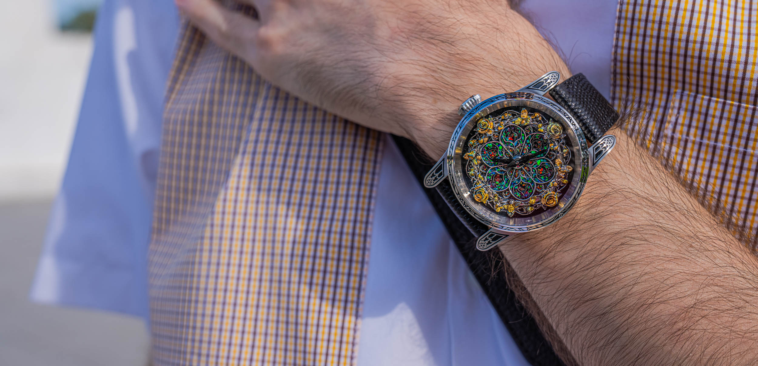 Bard's Whisper Divine Comedy Purgatorio Opal Crystal watch on the wrist of Marko Tadić, its opal rose window dial glowing against a Dsquared2 outfit in check and white
