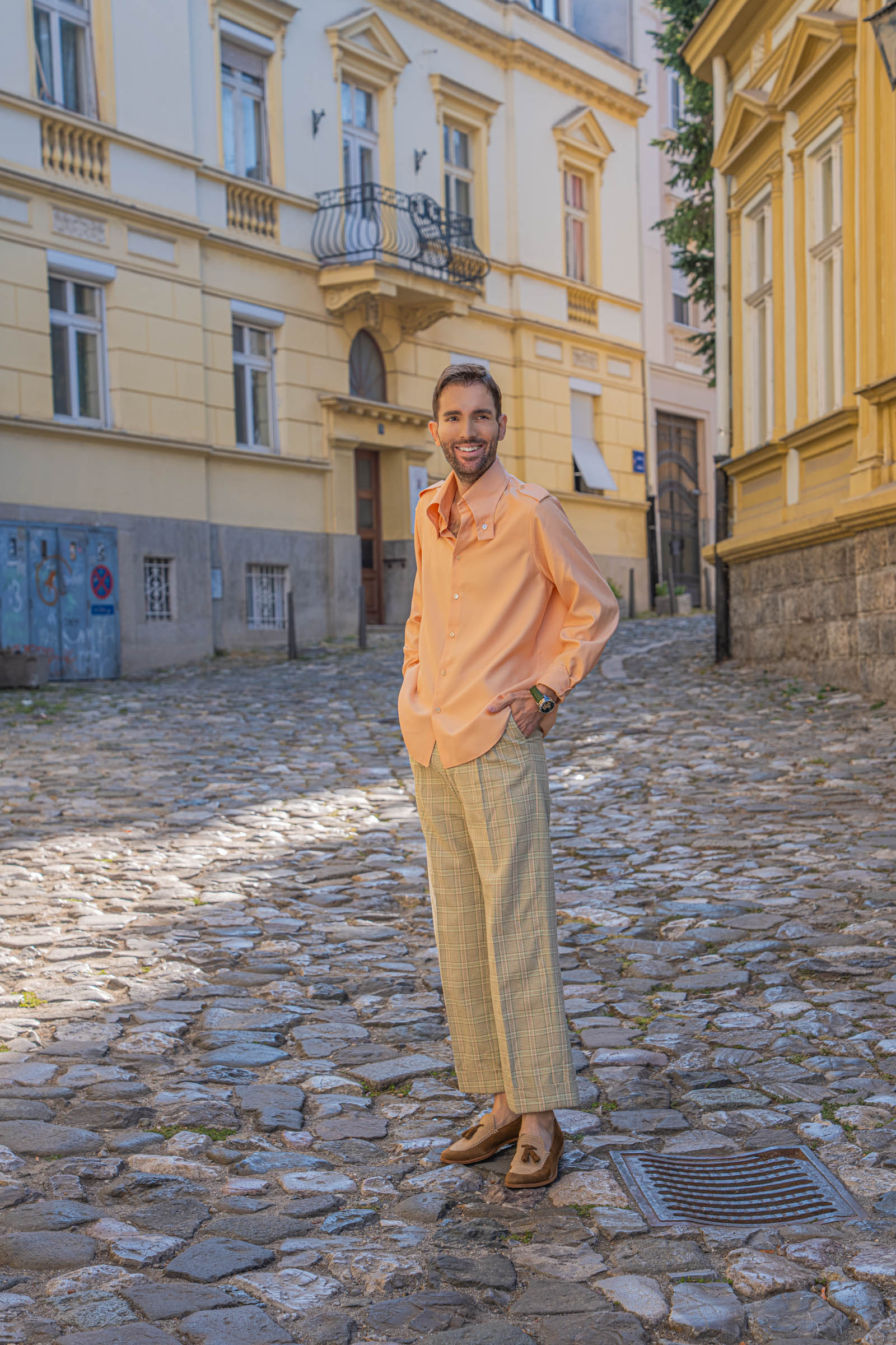 Marko Tadić, founder of Mr.M, on a cobblestone street in effortless Italian glamour by Gucci and Fratelli Rossetti