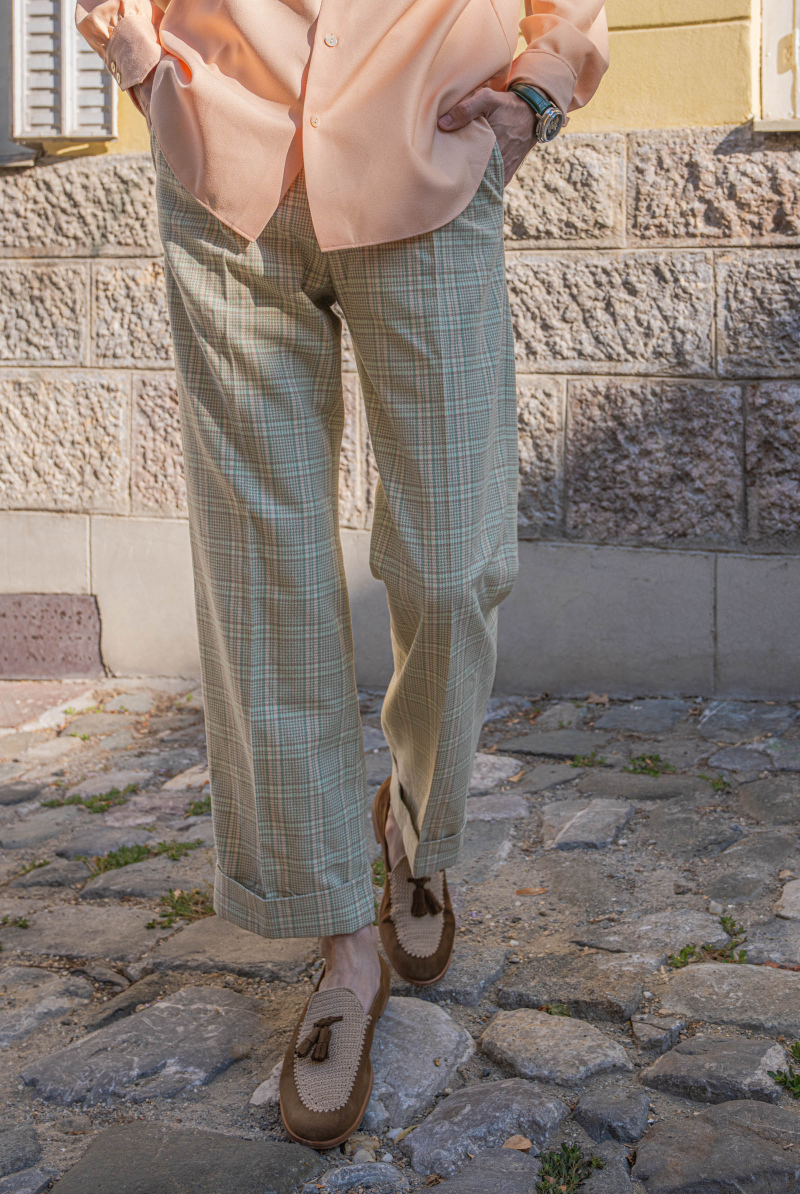 Marko Tadić walks in wide Gucci check wool trousers with turn-ups and Fratelli Rossetti Brera crochet loafers
