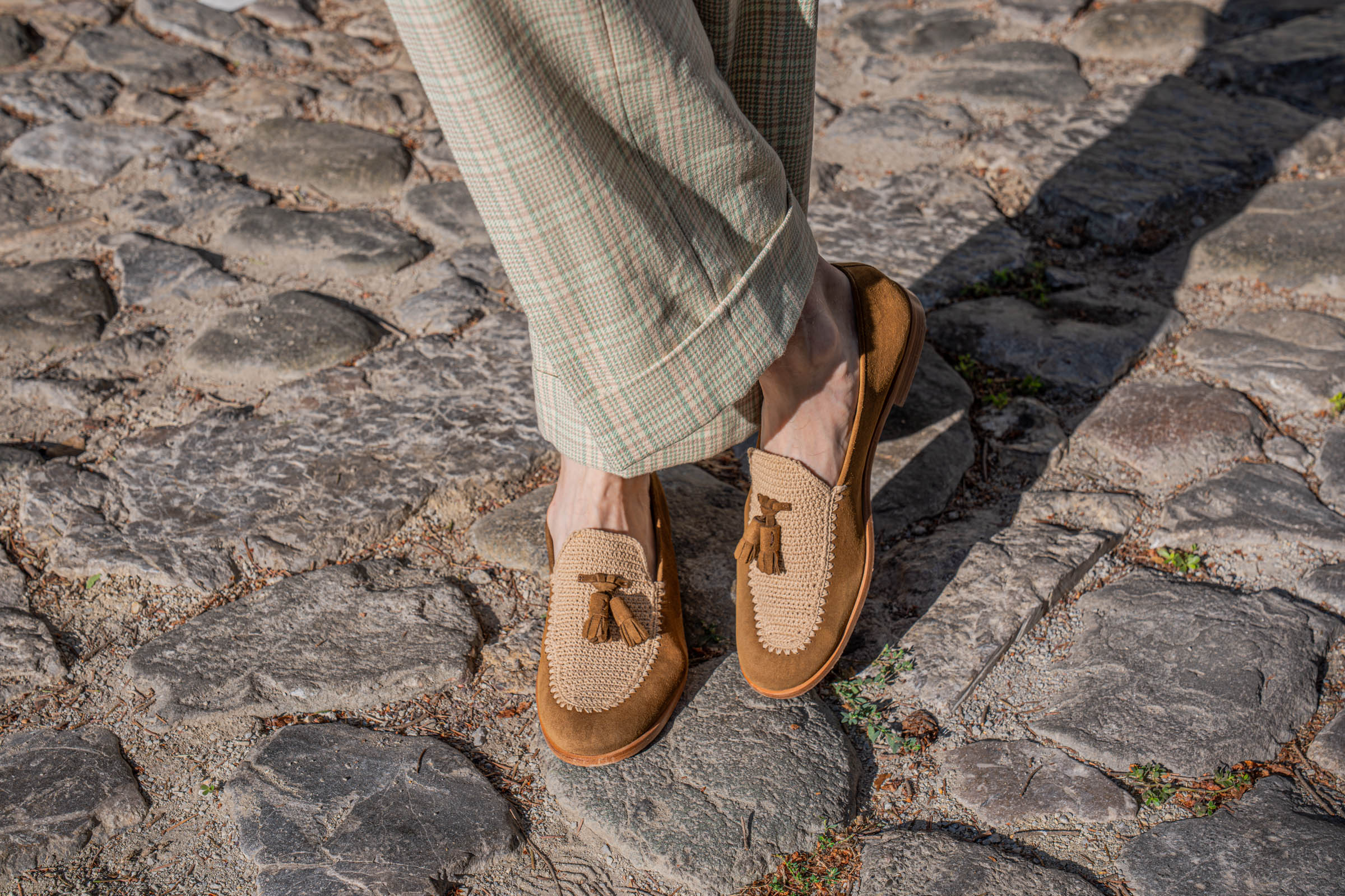 Fratelli Rossetti Brera crochet tassel loafers below the deep turn-ups of Gucci check trousers, worn by Marko Tadić